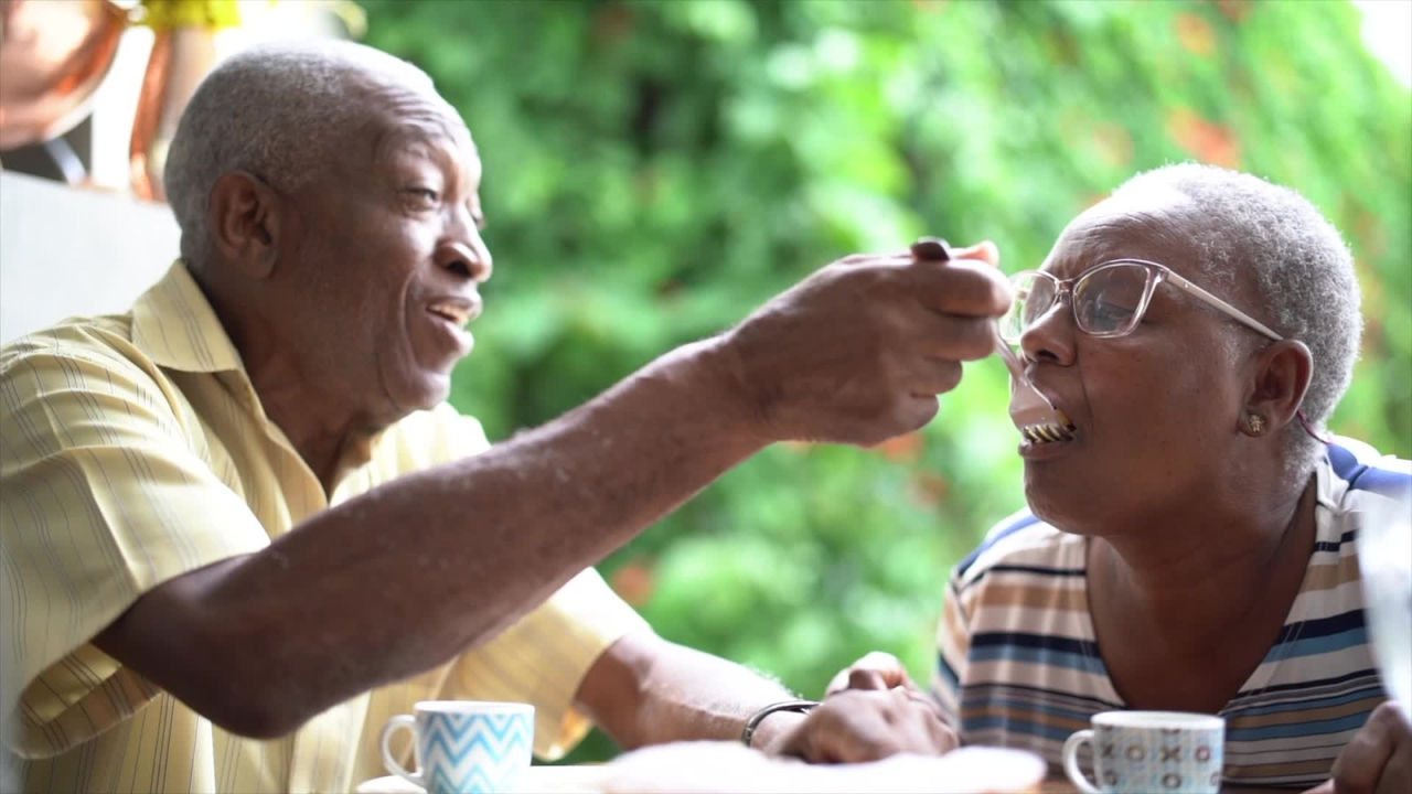Old couple eating together